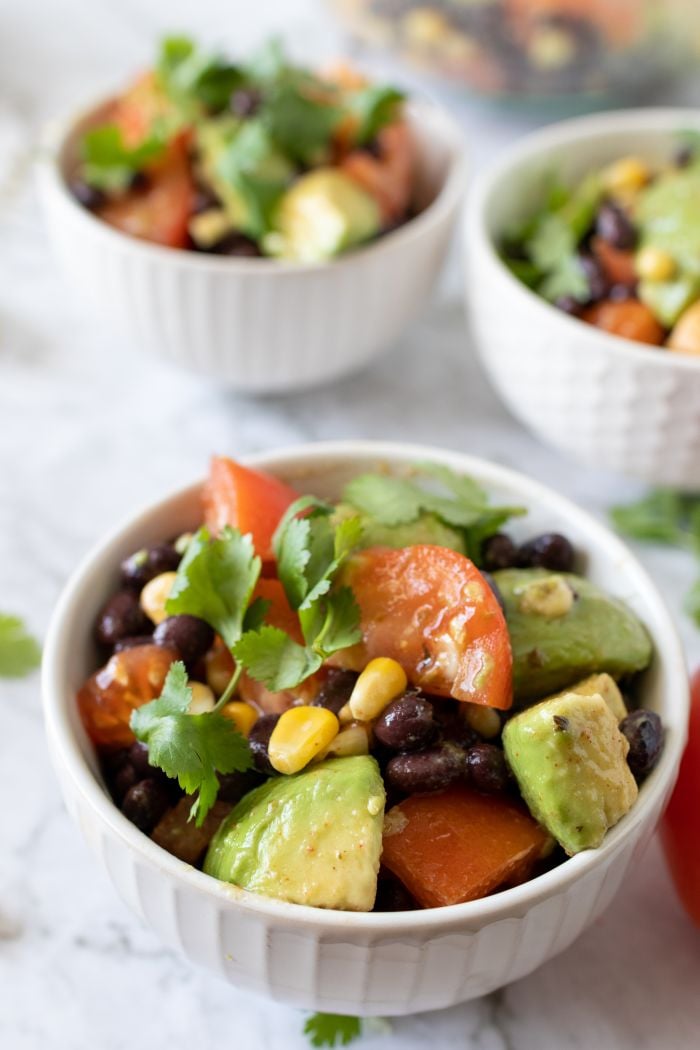 three small bowls of Mexican avocado salad are shown